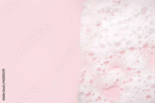Obraz na płótnie White foam bubbles texture on pink pastel background, copy space, banner for loundry, cleaning service, bathroom concept, clean, wash - liquid soap, shower gel, shampoo w salonie