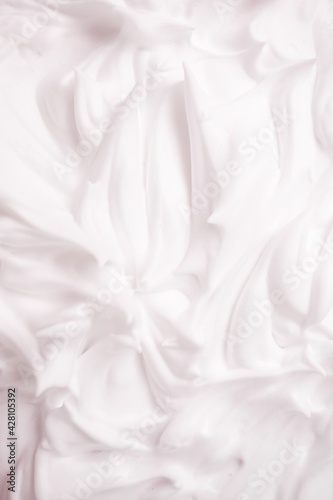 White cosmetic foam texture background. Cosmetic mousse, cleanser, shaving foam, shampoo. Foamy skin care product, skincare, male hygiene concept, copy space