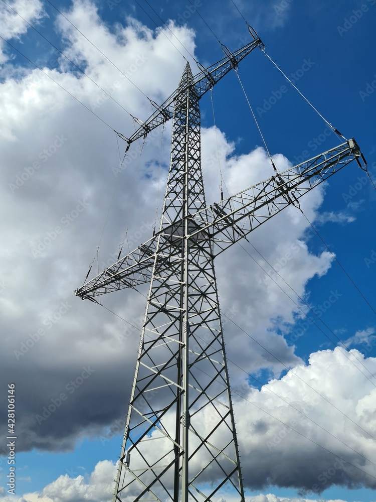 transmission tower in sunshine against blue sky
transmission tower in sunshine against blue sky
