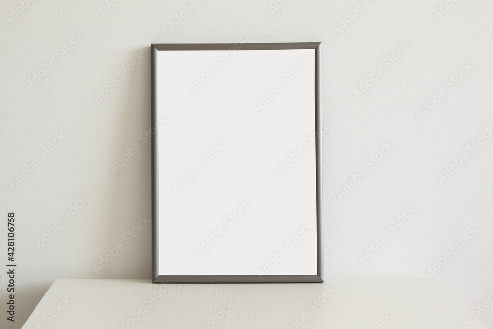 blank vertical portrait frame for images on white table blank vertical portrait frame for images on white table