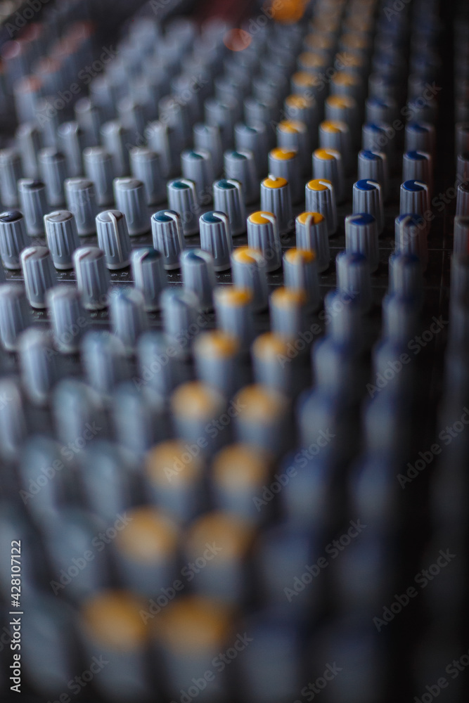 Fototapeta premium Professional audio studio sound mixer console board panel with recording , faders and adjusting knobs,TV equipment.