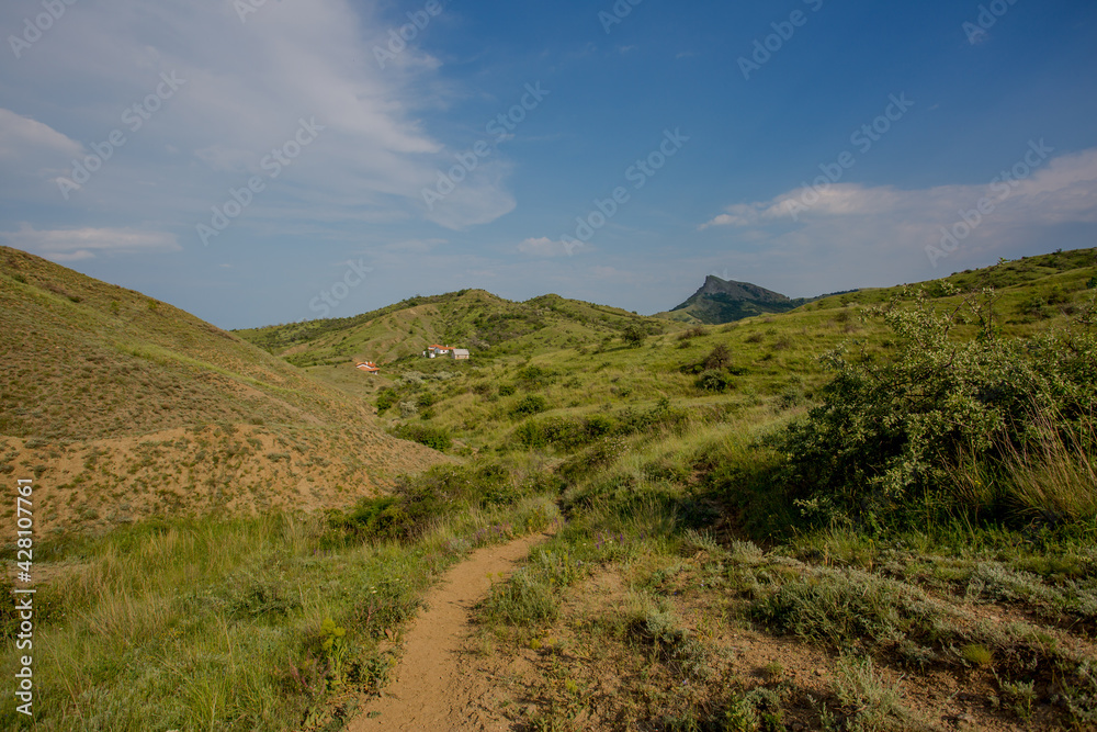 Walking in the mountains. Among the Crimean hills. Summer walk. Sunny day.