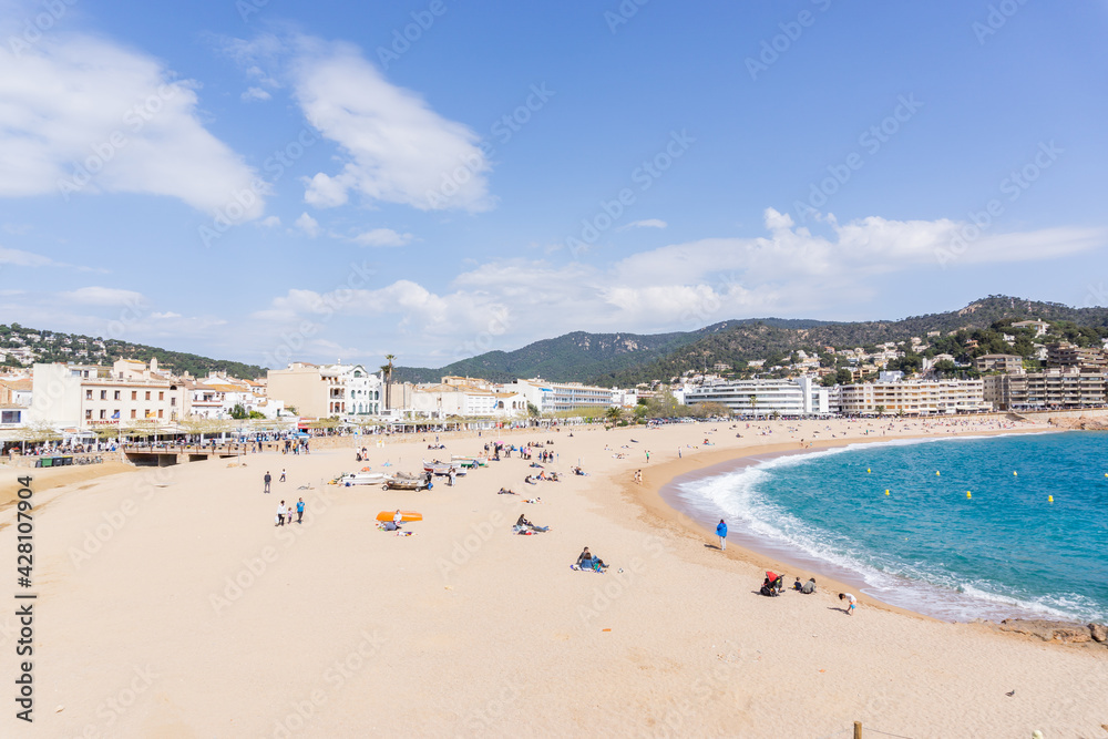 Image of people with protective masks on the beach of TOSSA DE MAR Image of people with protective masks on the beach of TOSSA DE MAR
