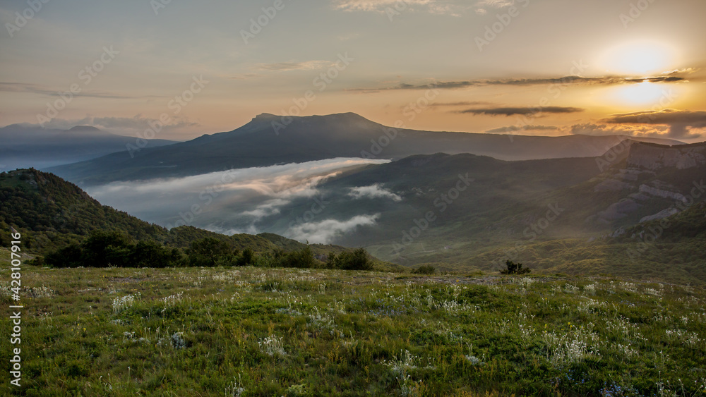 Walking in the mountains.Mount Demerdzhi in the Crimea. Sunset on the mountain. Fog in the mountains. Walking in the mountains.Mount Demerdzhi in the Crimea. Sunset on the mountain. Fog in the mountains.