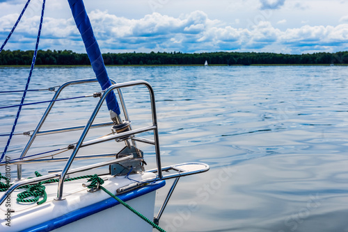 Sailing on a lake. view on a sailboat detail, sailboat bow. Summer vacations, cruise