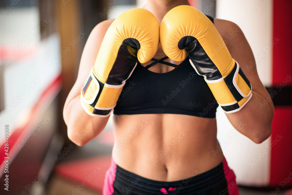 Woman in boxing gloves. Focus is on gloves. Woman in boxing gloves. Focus is on gloves.