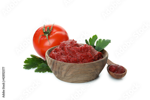 Fototapeta Wooden bowl and spoon with tomato paste isolated on white background