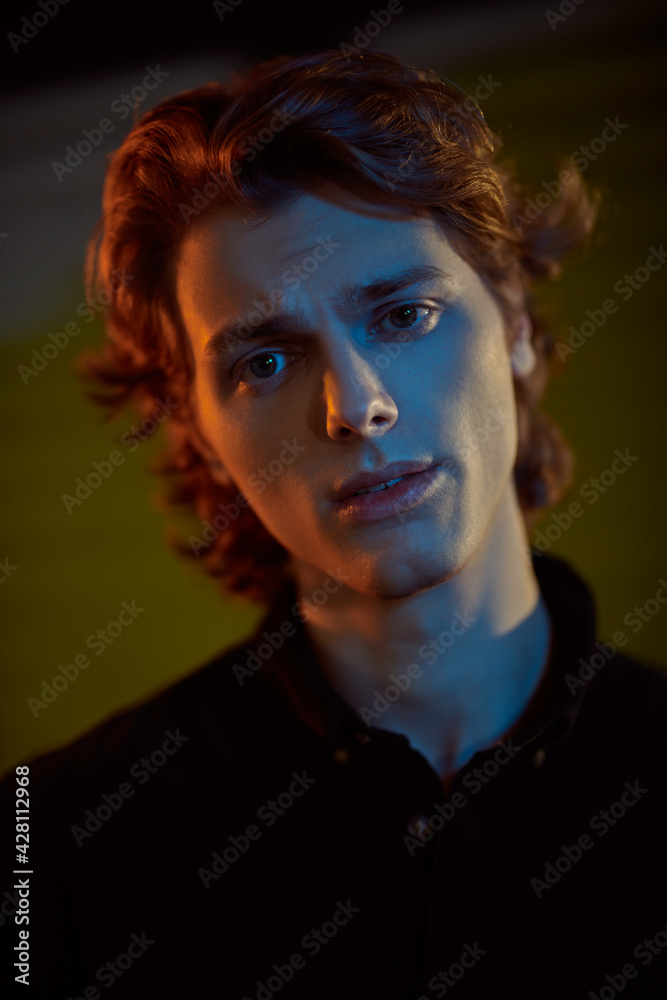 male face in mixed color light male face in mixed color light