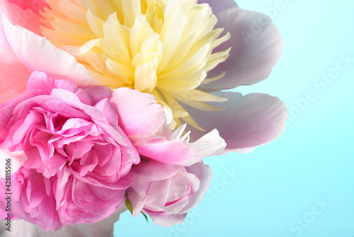 Fototapeta Naklejka Na Ścianę i Meble -  bouquet with white peonies and irises on a blue background.