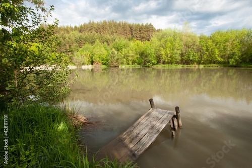 Foto Wooden bridge by the lake