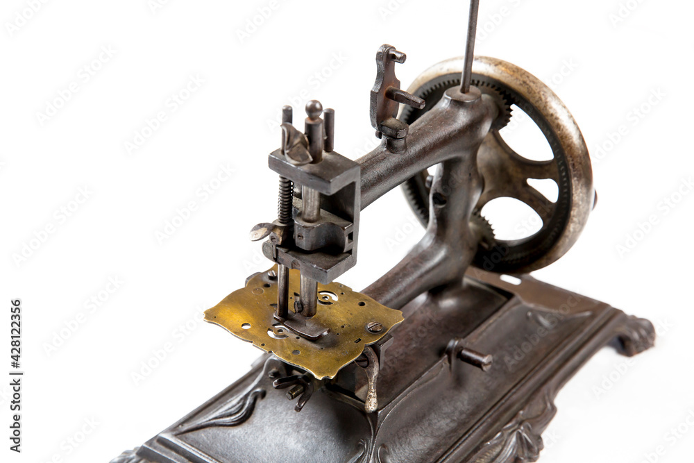 Fototapeta premium Old sewing machine on a white background