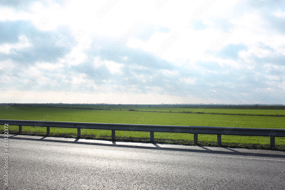 Beautiful view of asphalt highway without transport Beautiful view of asphalt highway without transport