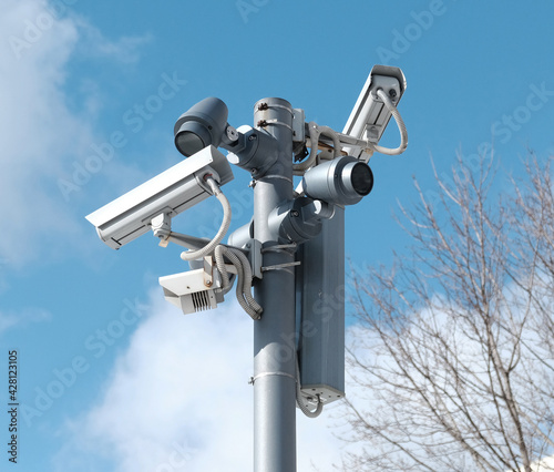 Real time Modern Online Security CCTV cameras surveillance system. An outdoor video surveillance cameras is installed on a metal post. Equipment system service for safety life or asset. 