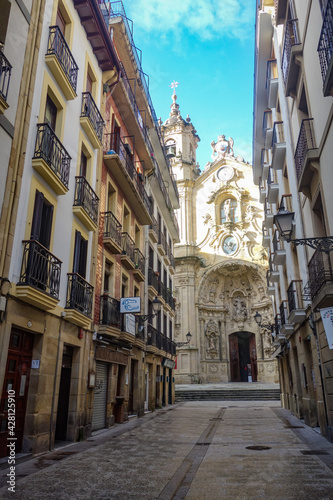 San Sebastian, Spain - Jan 10, 2021: the narrow streets and Basilica Church of Parte Vieja in the early morning