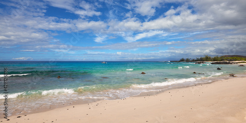 Panoramic view of the blue ocean and sky from the beach in Hawaii.