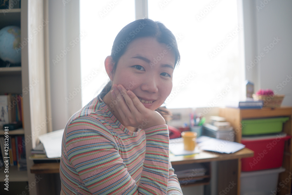 telework and remote job - lifestyle portrait of young happy and beautiful Asian Chinese woman working or studying at home office smiling cheerful and confident telework and remote job - lifestyle portrait of young happy and beautiful Asian Chinese woman working or studying at home office smiling cheerful and confident