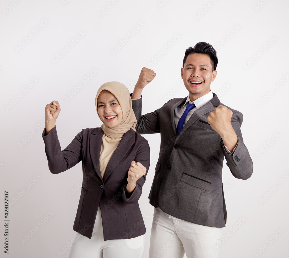 two young couples business very excited working looking at the camera isolated white background two young couples business very excited working looking at the camera isolated white background