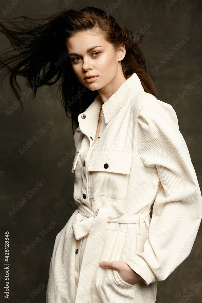 woman in fashionable clothes on a dark background and jumpsuit style shirt model woman in fashionable clothes on a dark background and jumpsuit style shirt model