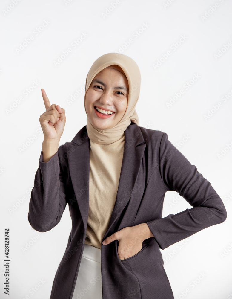 young businesswoman smiling pointing copy space, one hand in the suits pocket office work concept isolated white background young businesswoman smiling pointing copy space, one hand in the suits pocket office work concept isolated white background