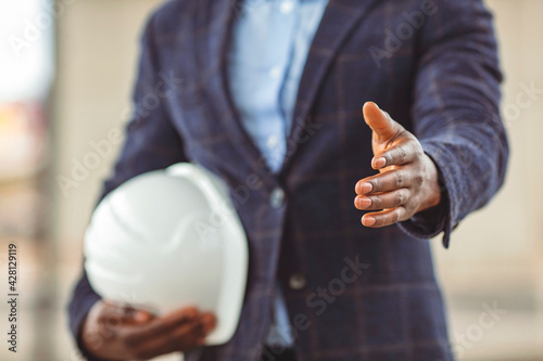 Canvas-taulu A architect is standing and shaking hands