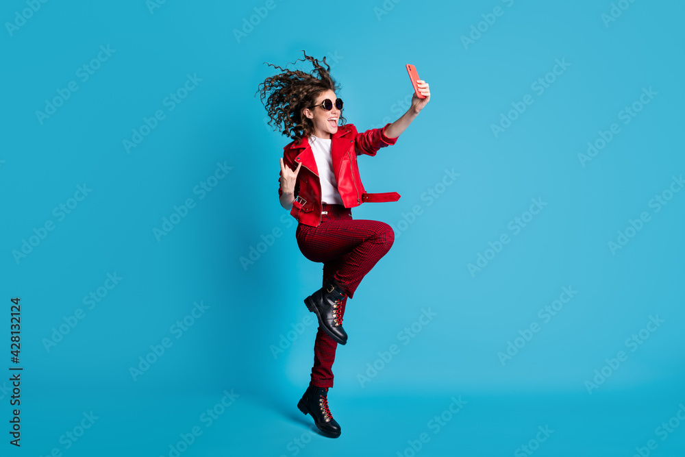 Full body profile portrait of carefree excited lady make selfie fingers show heavy metal symbol isolated on blue color background