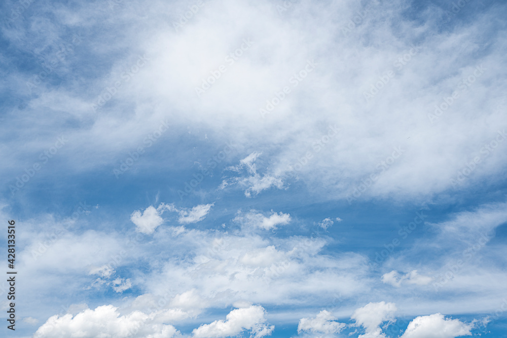 Clouds on a blue sky on a sunny day.