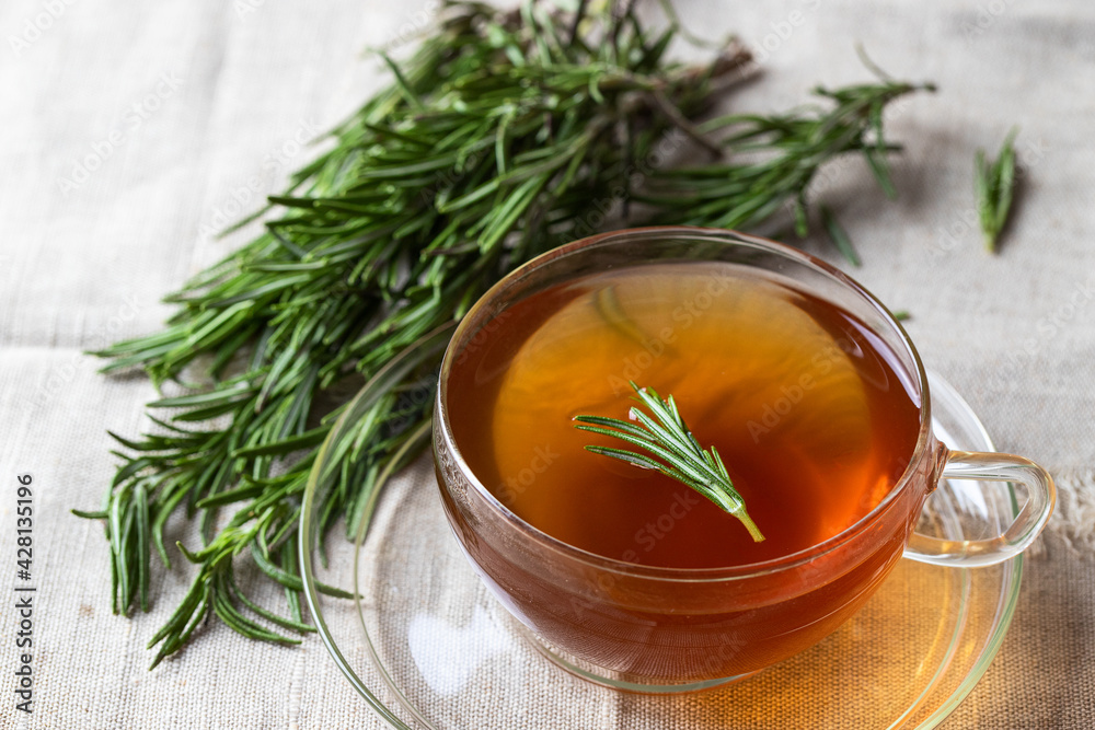 Close up of rosemary tea, popular herbal drink. Healthy warm beverage for health. Top view Close up of rosemary tea, popular herbal drink. Healthy warm beverage for health. Top view