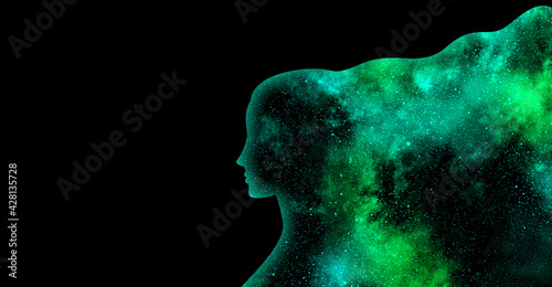 Green shining star universe in the shape of a woman's profile silhouette on a black background