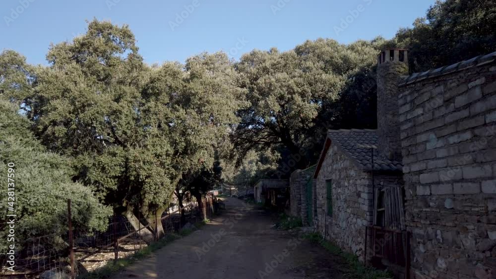 POV Walking on countryside dirt trail by rural stone houses in Benaocaz, Spain POV Walking on countryside dirt trail by rural stone houses in Benaocaz, Spain