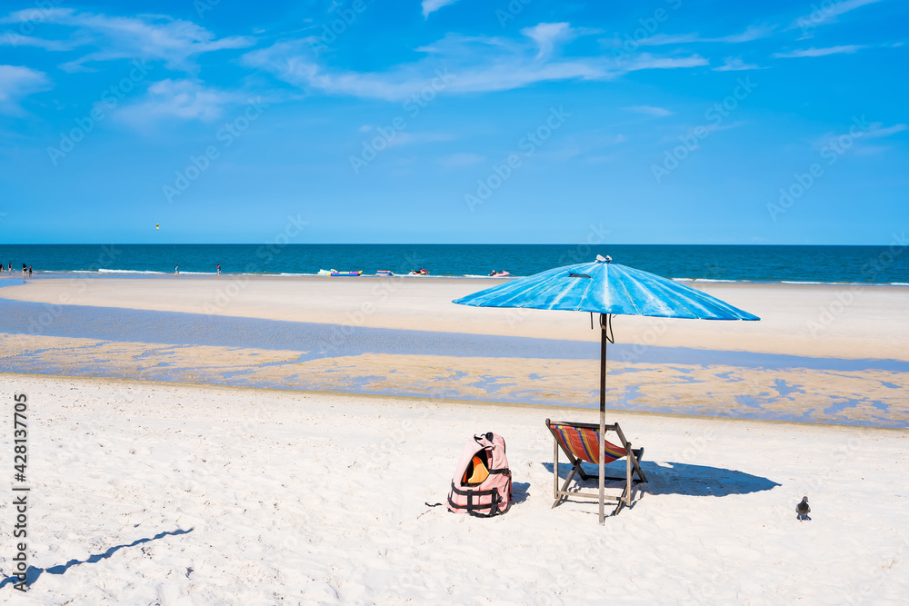 Tropical sea and beach with umbrella and deck chair wiht blue sky.Thai summer Tropical sea and beach with umbrella and deck chair wiht blue sky.Thai summer