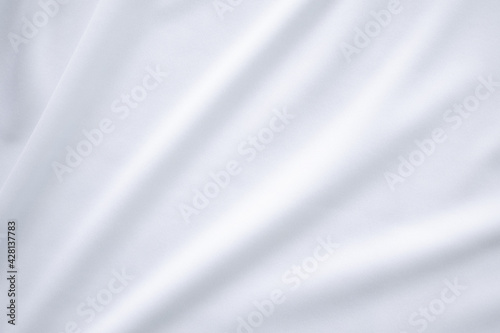 White fabric cotton background. display abstract texture luxury cloth soft wave. for well use text present or promote your goods, products on free space background. top view or flat lay.