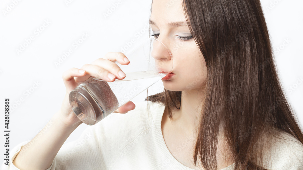 healthy lifestyle concept. Caucasian women drink clean water. A beautiful young girl leads a healthy lifestyle, drinks pure water. healthy lifestyle concept. Caucasian women drink clean water. A beautiful young girl leads a healthy lifestyle, drinks pure water.