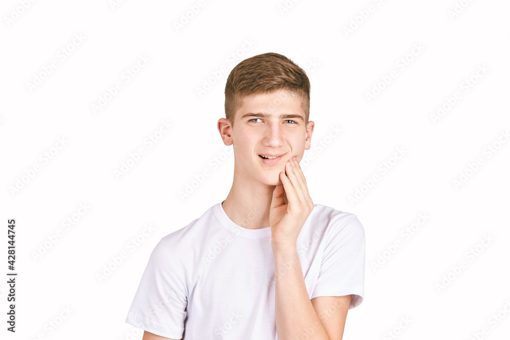 Children portrait in white t-shirt. Studio isolated concept. Toothache problem. Dental care. Bad face emergency. Boy sesitivity Children portrait in white t-shirt. Studio isolated concept. Toothache problem. Dental care. Bad face emergency. Boy sesitivity