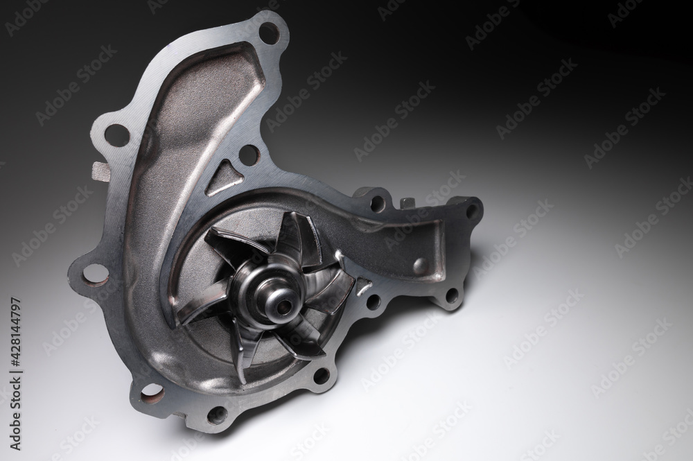 Water pump of the internal combustion engine cooling system. Contrasting on a gray gradient