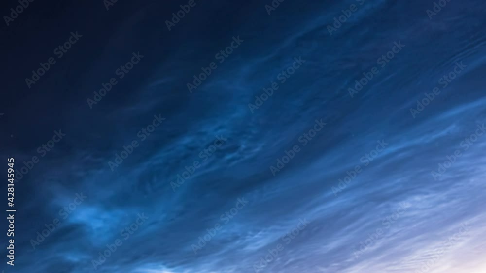 Beautiful abstract blue gradient blurred background. Timelapse of the night sky and silvery clouds. Defocusing Beautiful abstract blue gradient blurred background. Timelapse of the night sky and silvery clouds. Defocusing