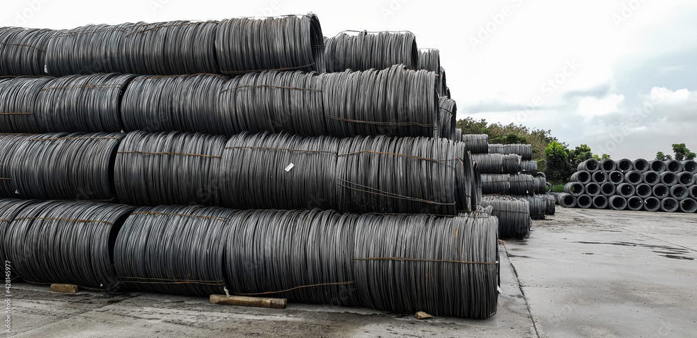Stacked of high carbon wire rod for heavy industry production,Pile of metal steel wire roll for construction site, concrete usage and building construction Stacked of high carbon wire rod for heavy industry production,Pile of metal steel wire roll for construction site, concrete usage and building construction
