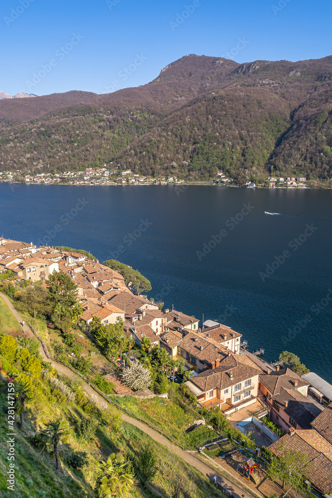 The picturesque village of Morcote in Ticino at the Lake Lugano is one of the most beautiful villages in Switzerland. View at the italian Cuasso al Lago.