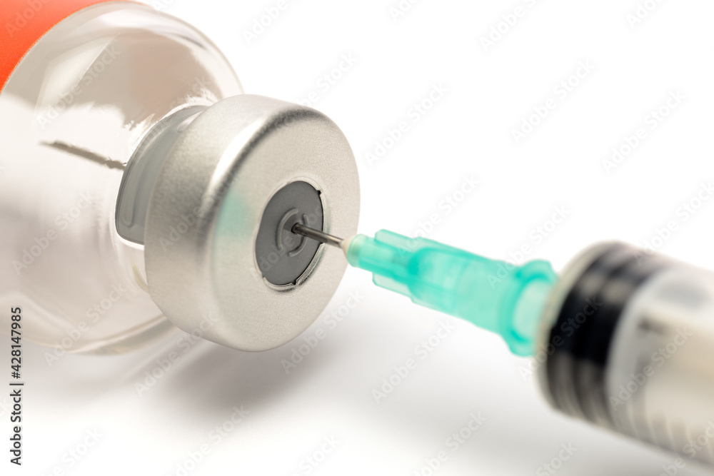Syringe in a Glass Vial Preparing an Injection Syringe in a Glass Vial Preparing an Injection