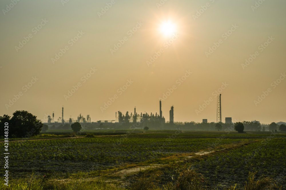 Industry factory buidling with modern warehouse in morning sunrise sky background. Environmentally friendly manufacturing plant of new technology production line