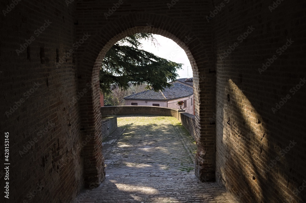 An archway of a medieval building in an Italian village (Marche, Italy, Europe)