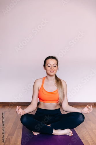 Gorgeous woman meditates while doing yoga. Yoga concept, calm an