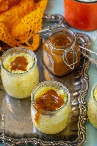 Sweet creamy rice pudding with caramel topping toffee