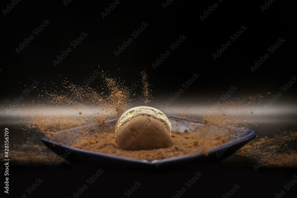 Splash photography - french macaron and cacao powder - obrazy, fototapety, plakaty 