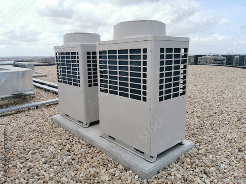 View of exterior VRV air conditioning units, extraction and insufflation, HVAC system, on the building roof photo