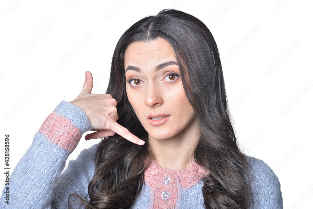 portrait of beautiful woman with call me gesture portrait of beautiful woman with call me gesture