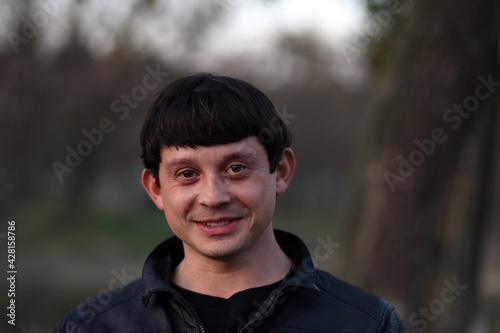 Portrait of a brunette man in the park © Сергей Луговский