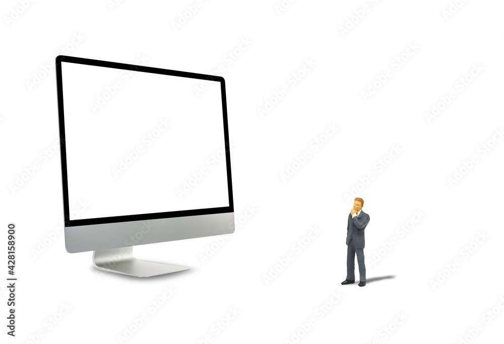 Business Concept : Miniature businessman standing and looking to desktop computer display with blank white screen. Business Concept : Miniature businessman standing and looking to desktop computer display with blank white screen.