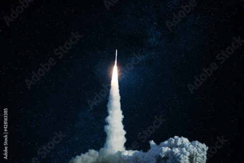 Fototapeta Naklejka Na Ścianę i Meble -  Successful launch of a space rocket into outer space. Spaceship lift off into the starry sky. Travel and exploration other planets, concept
