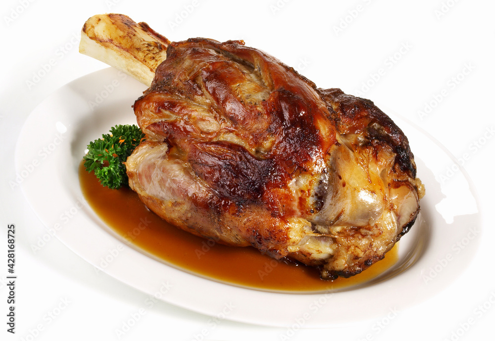Roasted Veal Shank with Sauce - Isolated on white Background Roasted Veal Shank with Sauce - Isolated on white Background