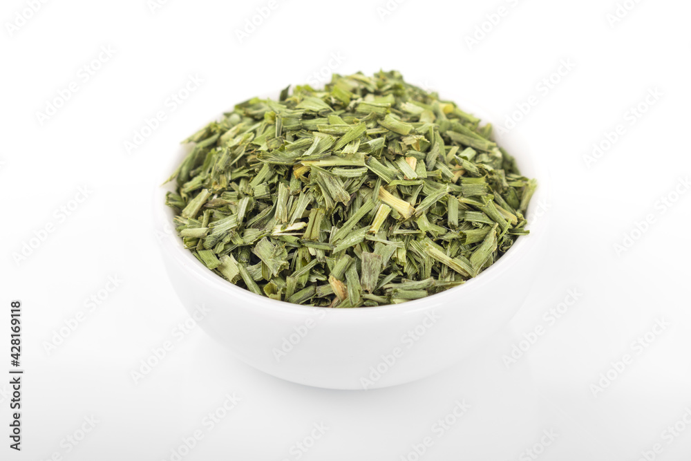 dry chopped spring onion in white bowl on white background. dry chopped or scallion. dry green onion, chopped onion, chopped spring onion. dry chopped spring onion in white bowl on white background. dry chopped or scallion. dry green onion, chopped onion, chopped spring onion.